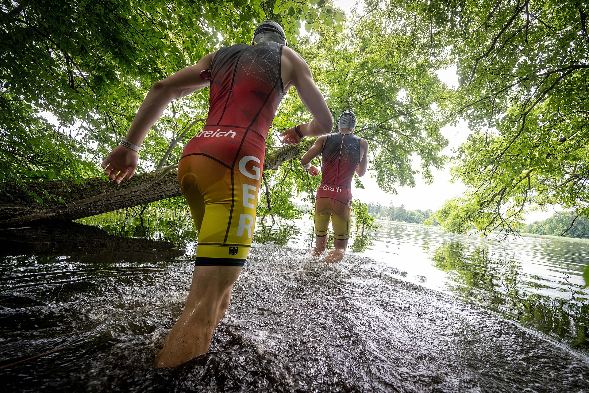 Image of participants walking into a river